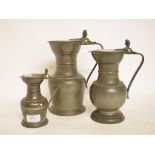 A set of three graduated pewter measures