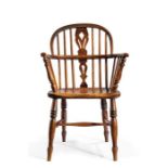 A HOOP BACK ASH WINDSOR ARMCHAIR