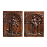 A PAIR OF CARVED OAK PANELS OF FEMALE SAINTS