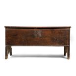 A SUBSTANTIAL BOARDED OAK COFFER