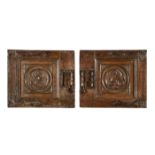 A PAIR OF CARVED OAK DOOR PANELS