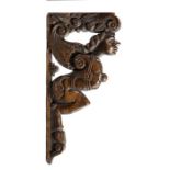 A CARVED OAK FIGURAL BRACKET