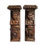 TWO ENGLISH CARVED OAK TERMS