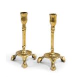 A GROUP OF BRASS CANDLESTICKS