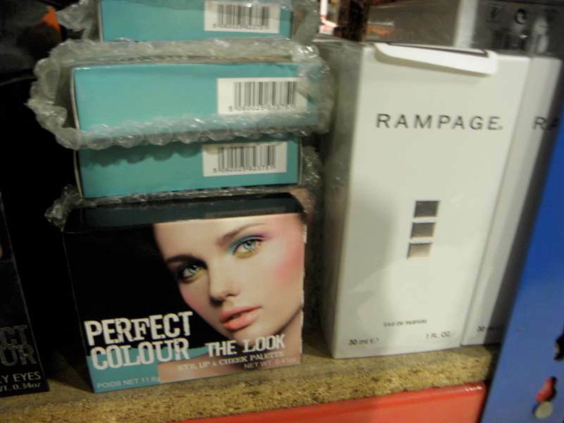 LOT CONTAINING 50 X 30 ML RAMPAGE EDP, 25 X PERFECT COLOUR THE LOOK EYE / LIP AND CHEEK PALETTE