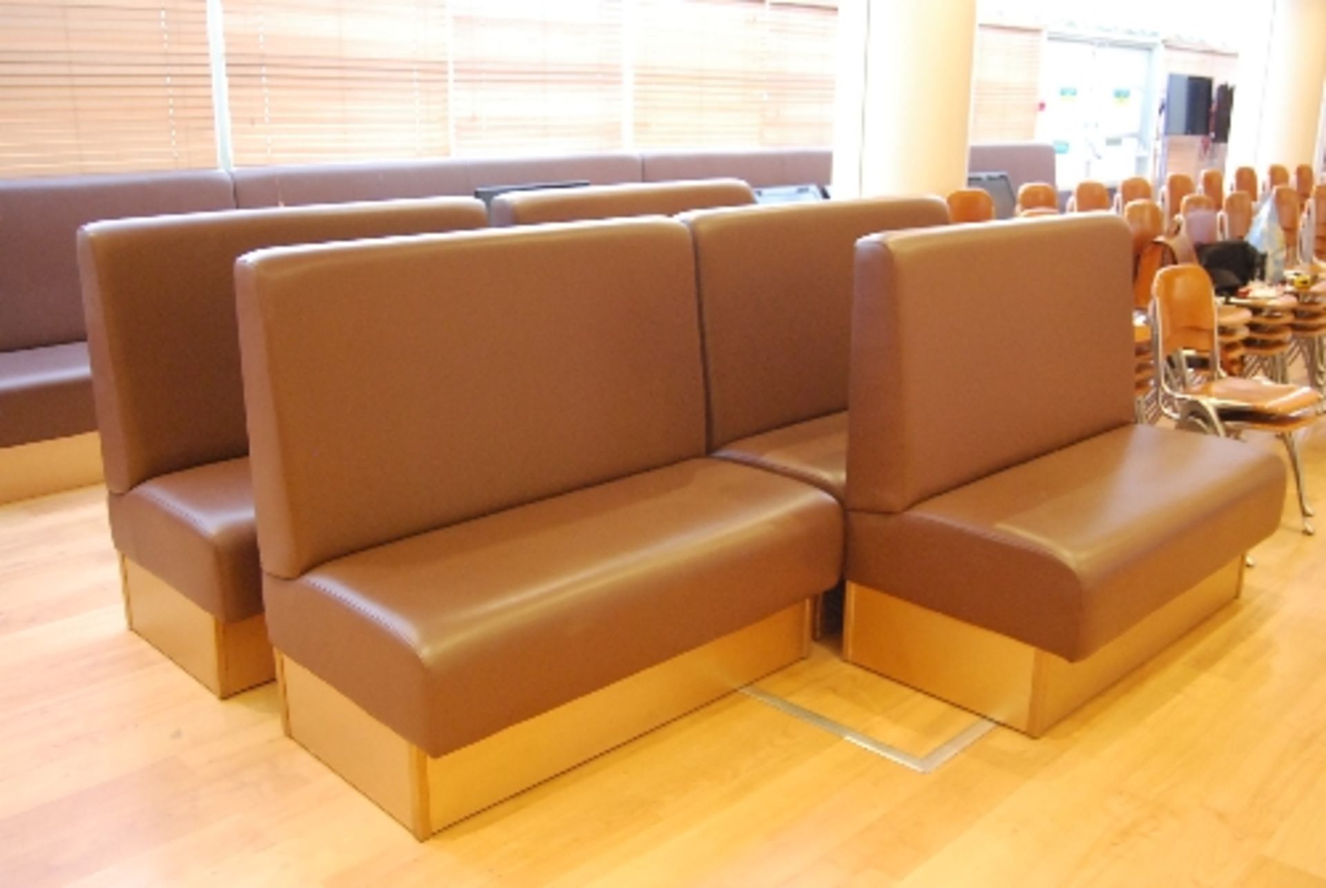 5 - Wooden framed brown leatherette upholstered bench seats each 1.25m wide