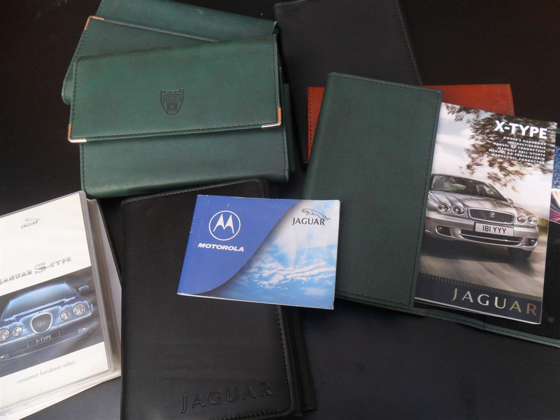 Jaguar handbooks, in original wallets