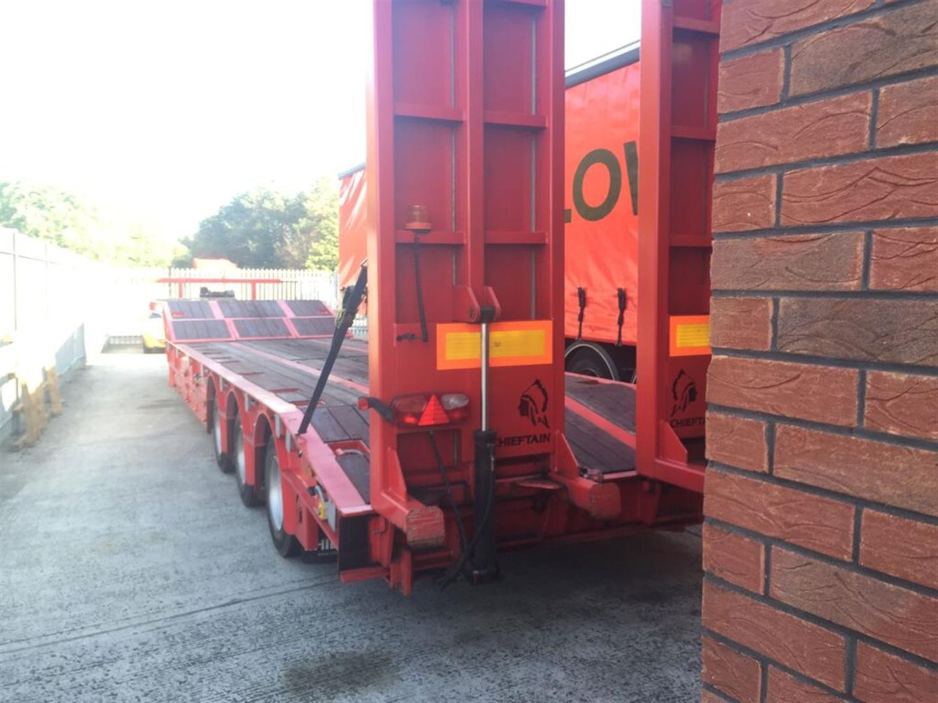 2009 Chieftain tri-axle step frame low loader trailer with hydraulic ramps and wooden floor - Image 2 of 2