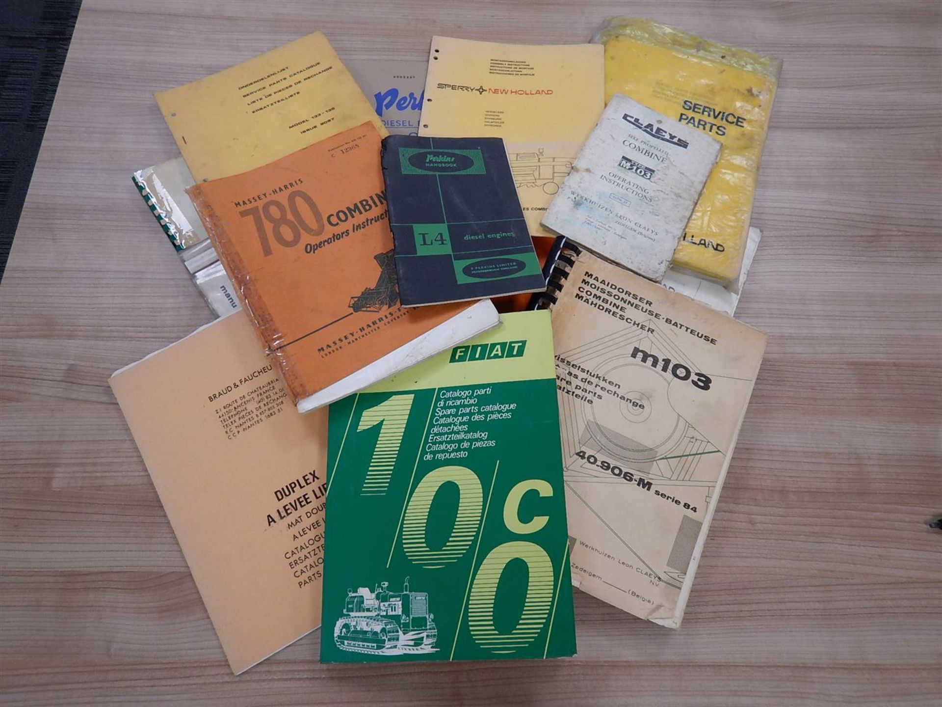 Qty tractor and combine manuals to include; Fiat 100c, New Holland 1530, Massey Harris 780, Hymac