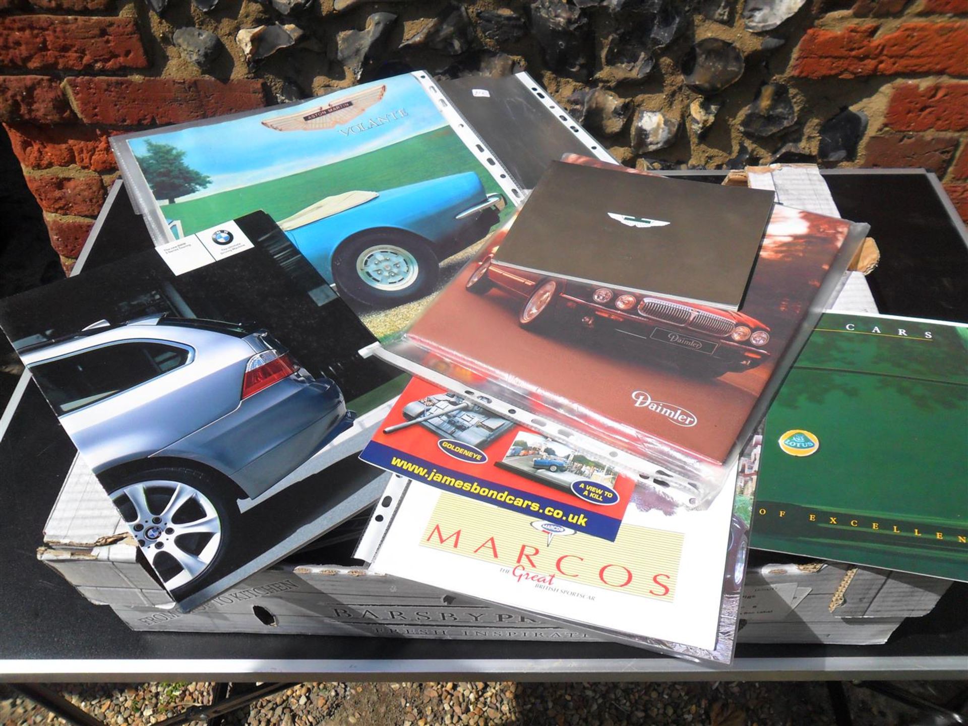 Qty of car catalogues to include; Lotus, Marcos, Aston Martin t/w caravan catalogues