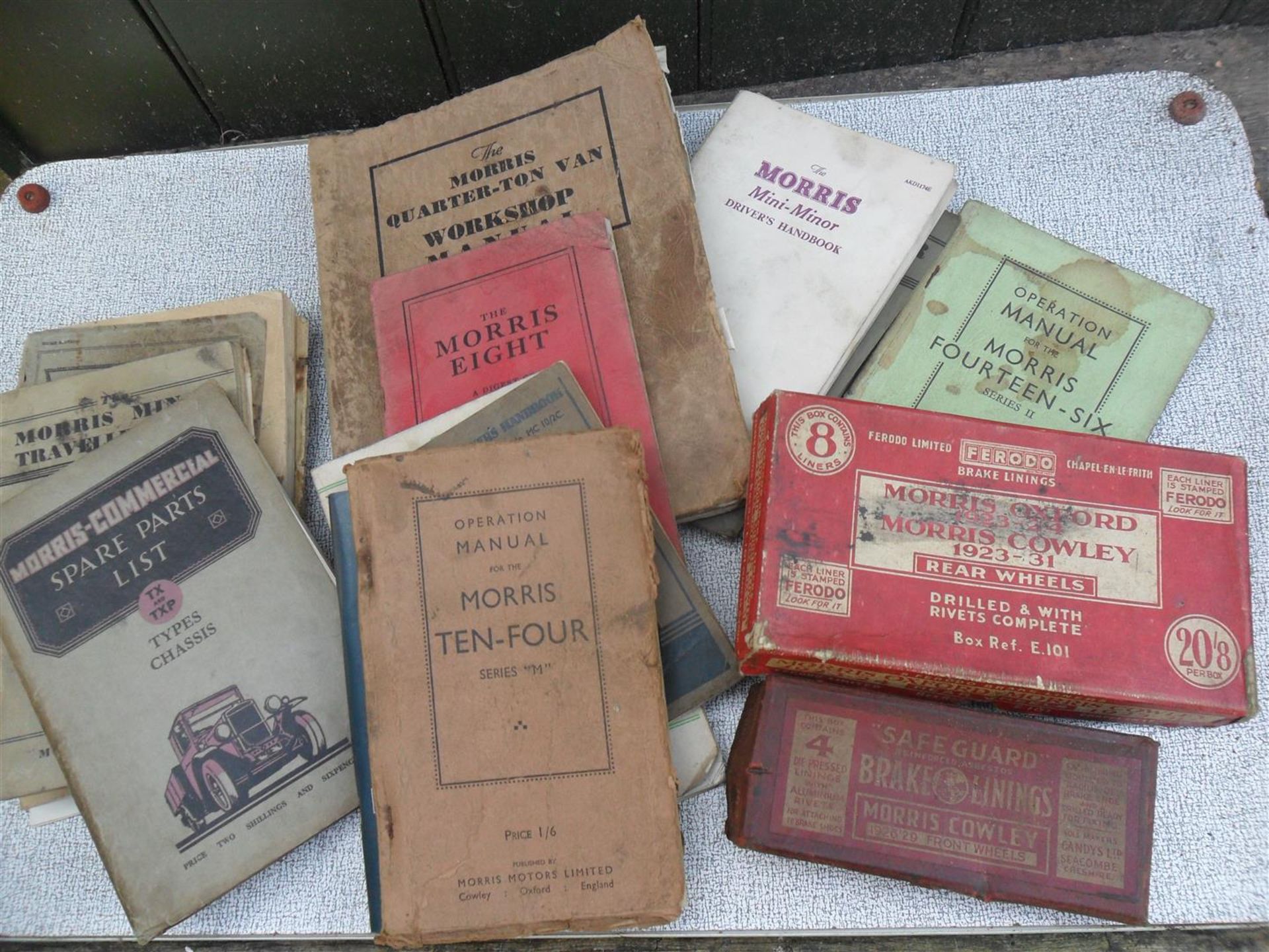 A collection of 1930s and other Morris manuals and 2 Morris boxes