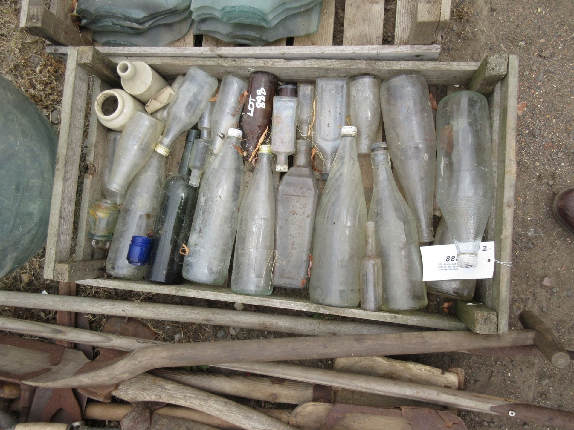 Old distilled water bottle and various vintage bottles