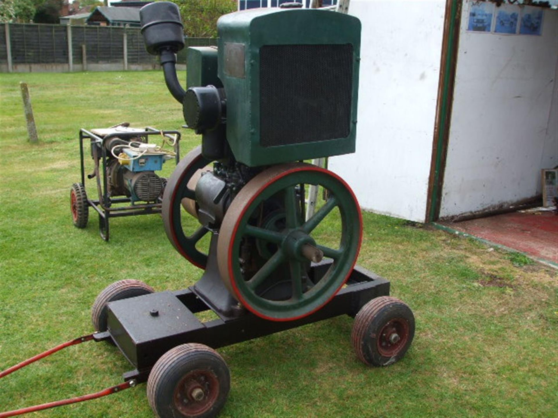 Lister CS 6hp vertical water cooled stationary engine No. CS89101trolley mounted c/w radiator. Ex