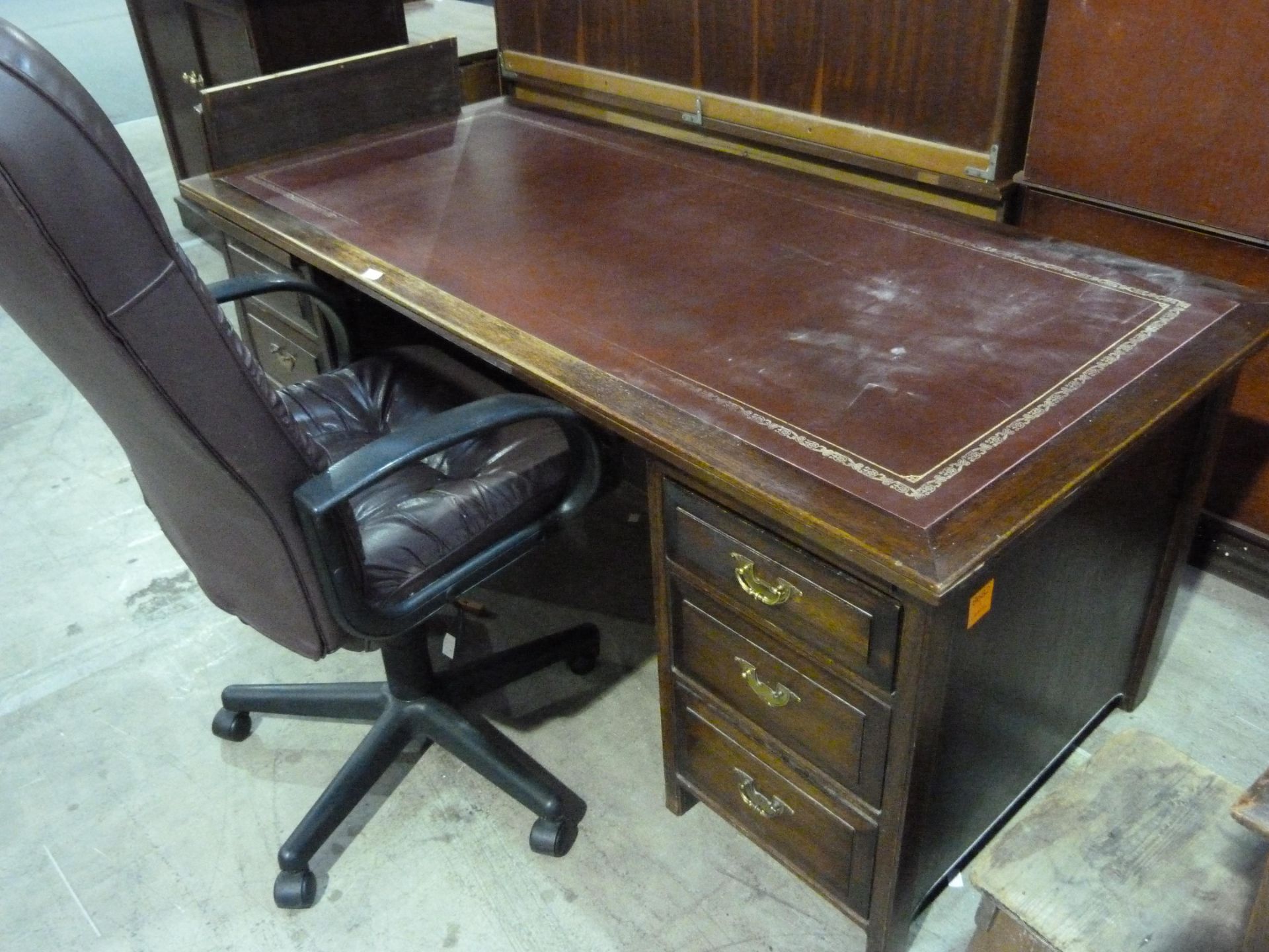* A red leather topped twin pedestal desk with 3 drawers either side together with a 4 drawer red