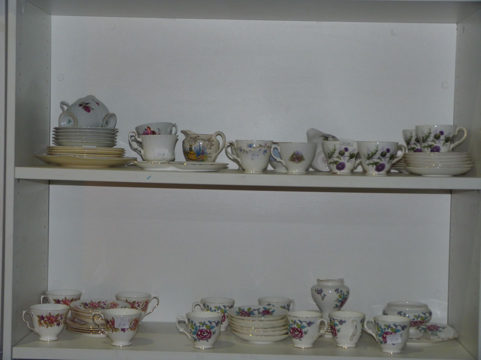 Two shelves to contain tea cups & saucers from Duchess 'Tranquility' & 'Thistle' range, Royal