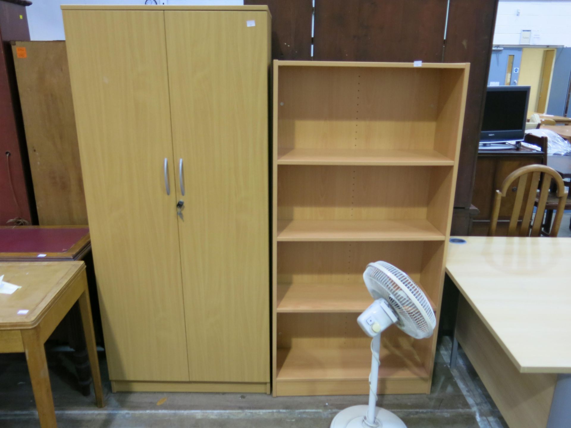 * 1 x Corner office table, 1 x bookshelf, 1 x 2 door cupboard & a fan - Image 2 of 2