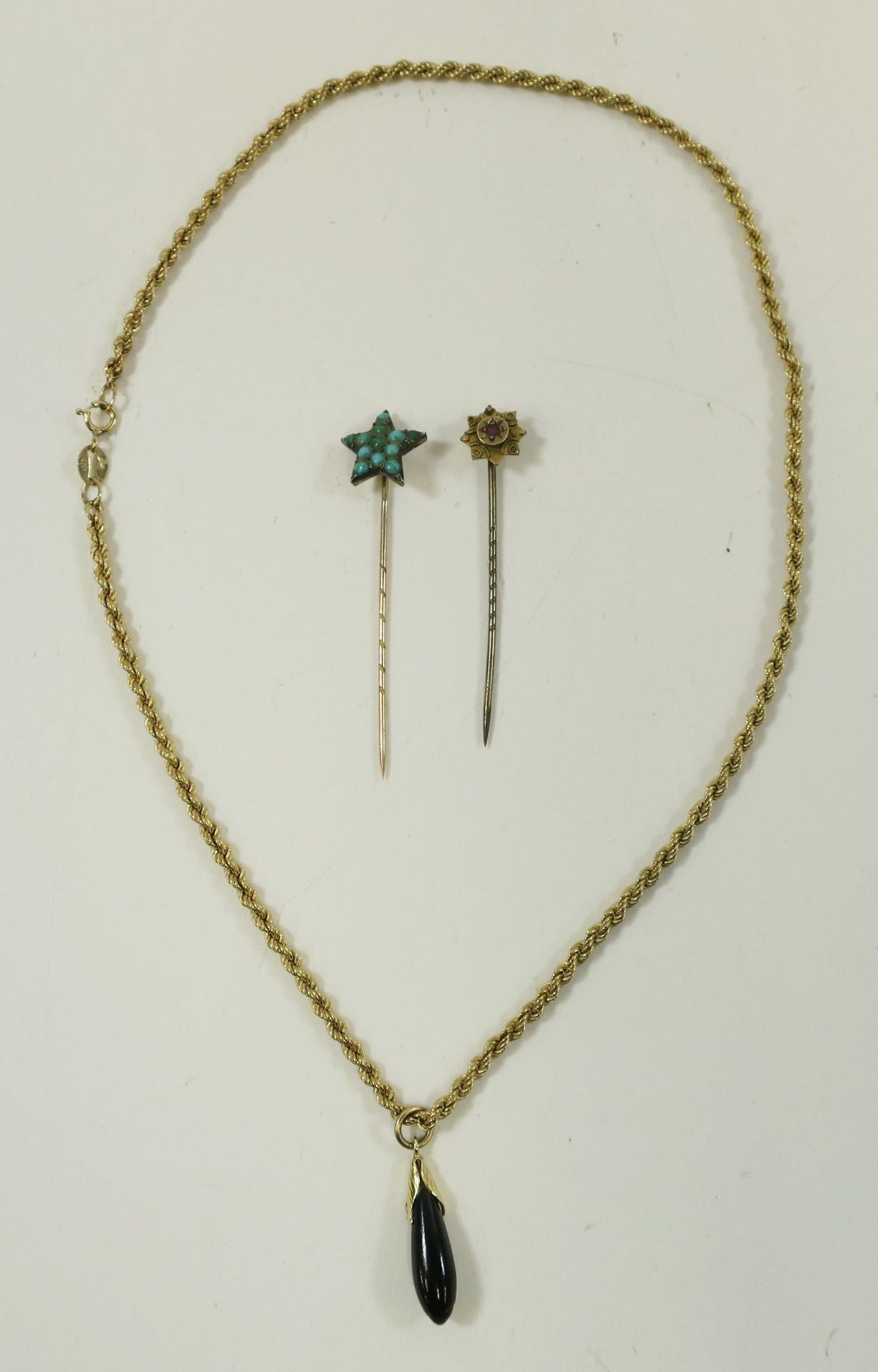 A 9ct Gold Rope Twist Chain (40cm long, 2.8gms) with a drop pendant in the form of a fruit with Gold