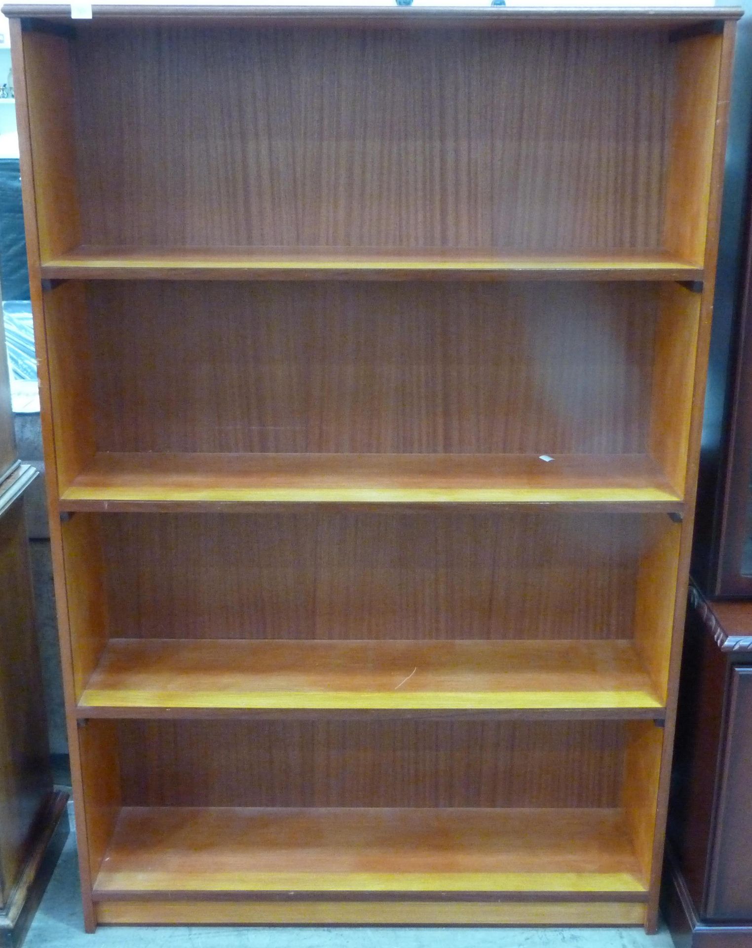 * A four tier shelf unit (H170cm, L114cm, W51cm) (est £30-£40)