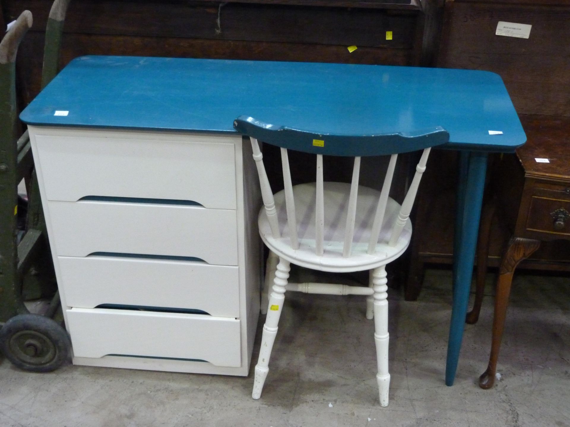 A turquoise & white painted four drawer desk & chair (H78cm, L117cm, W46cm) along with a vintage