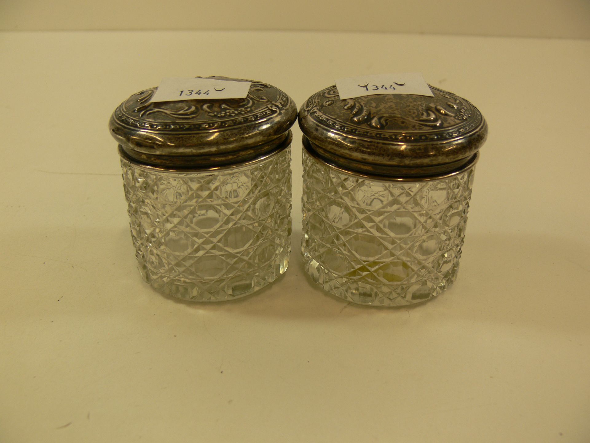 Two hallmarked silver top glass jars (tops 20g approx) (2) (est £25-£50)