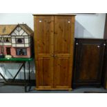 This is a Timed Online Auction on Bidspotter.co.uk, Click here to bid. A pine wardrobe with metal