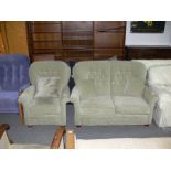 This is a Timed Online Auction on Bidspotter.co.uk, Click here to bid. A green two seater sofa