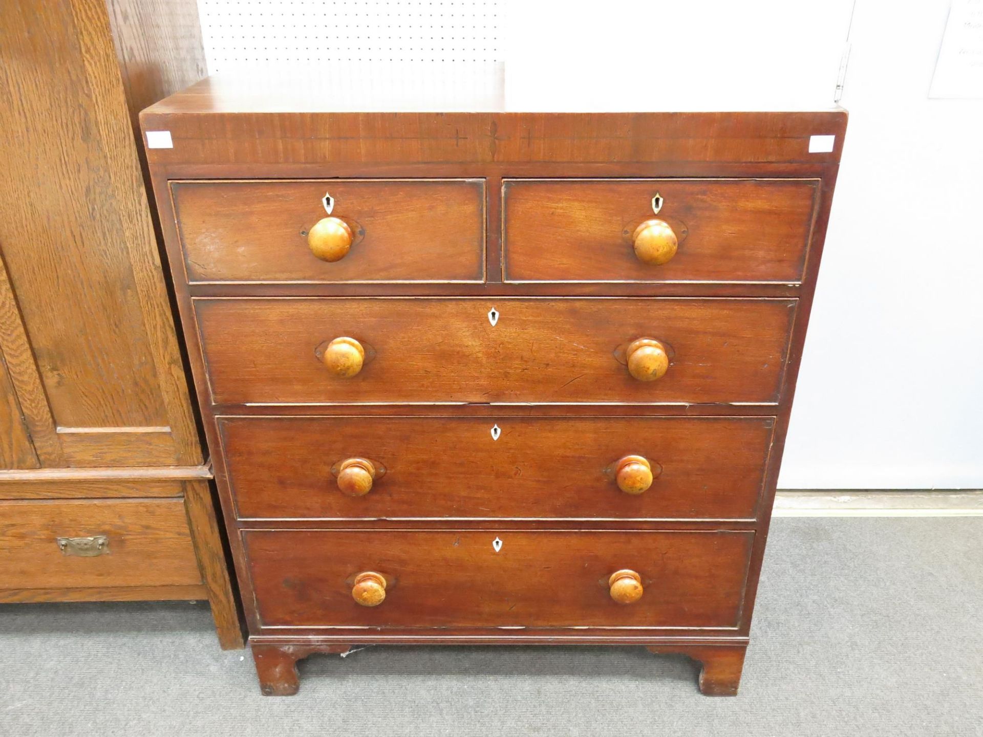 A Victorian Mahogany five drawer chest on bracket feet (Height- 109cm, Width- 91cm, Diameter-