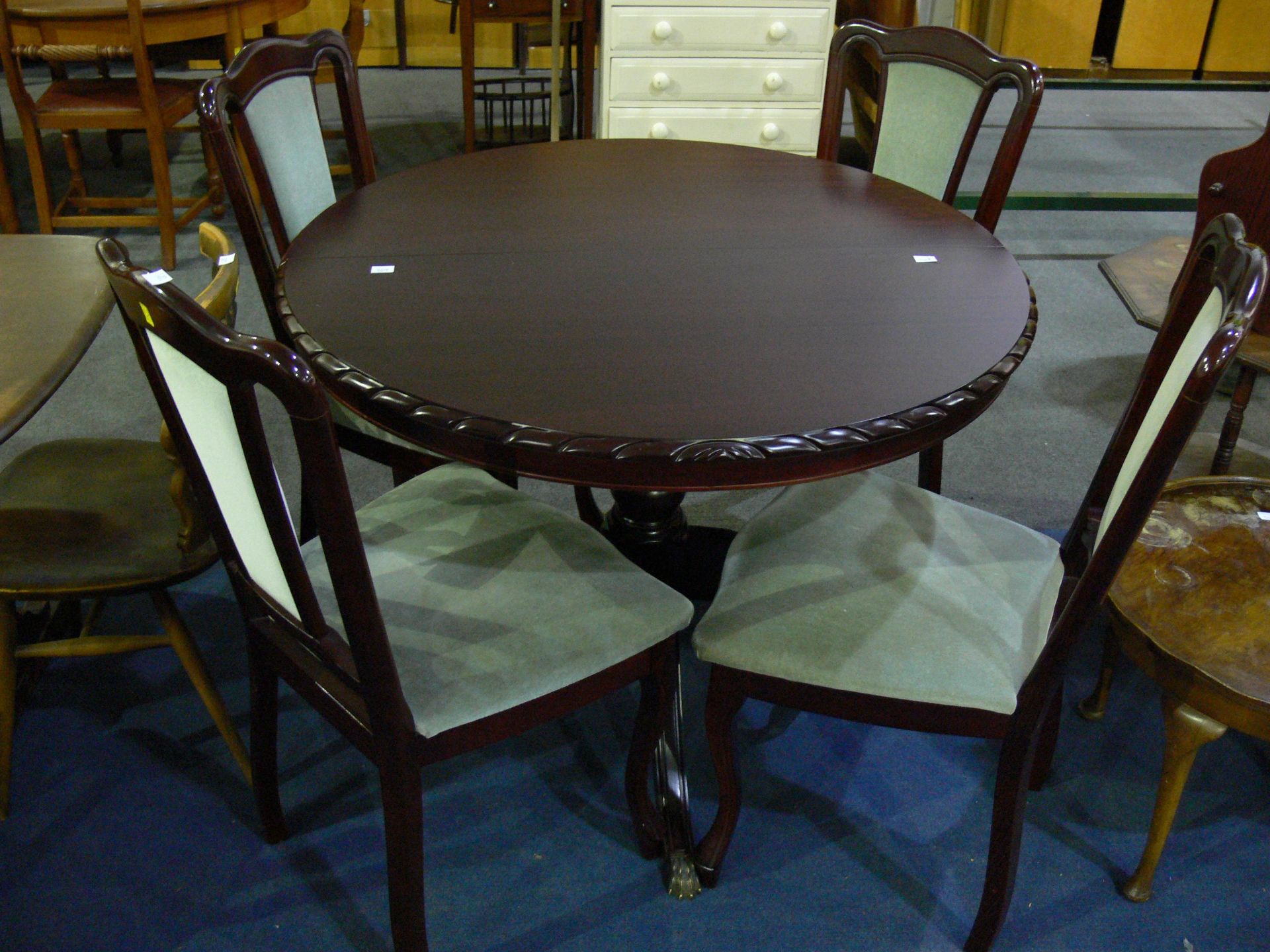 A John Coyle extending dining table with four dining chairs (H79cm, L106cm, 147cm open) (est £50-£80