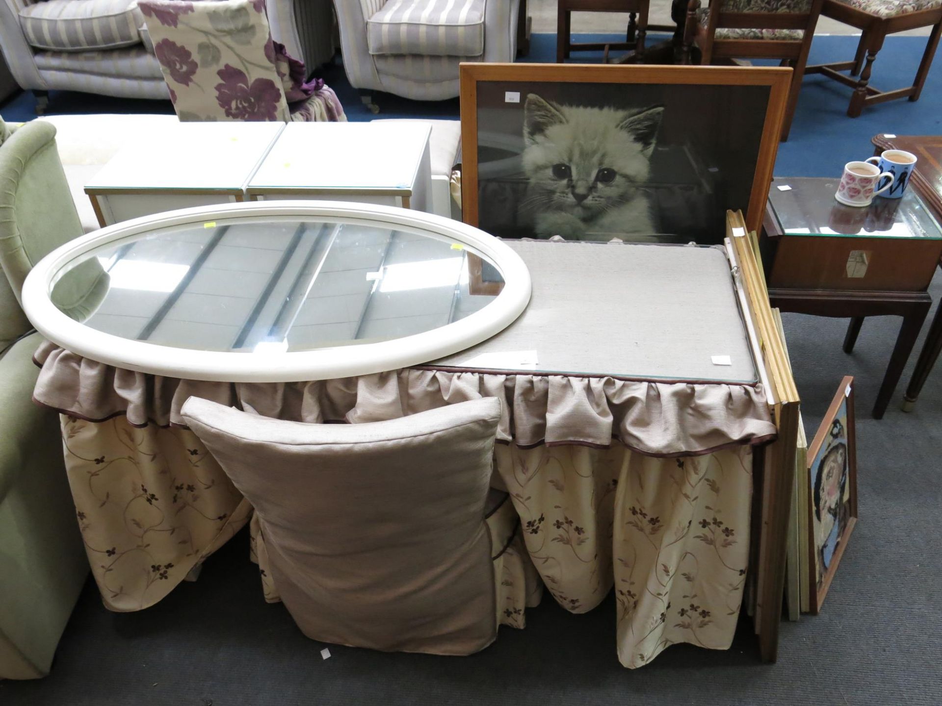 A fabric covered table with glass top together with a covered chair, Large framed picture of a