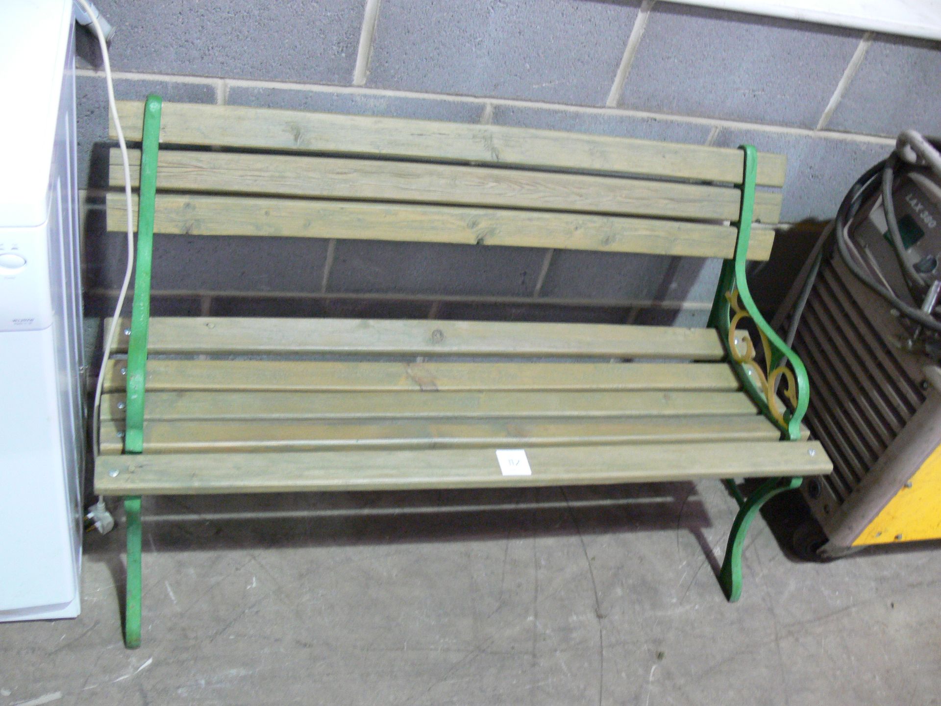 A metal framed wooden slatted garden bench