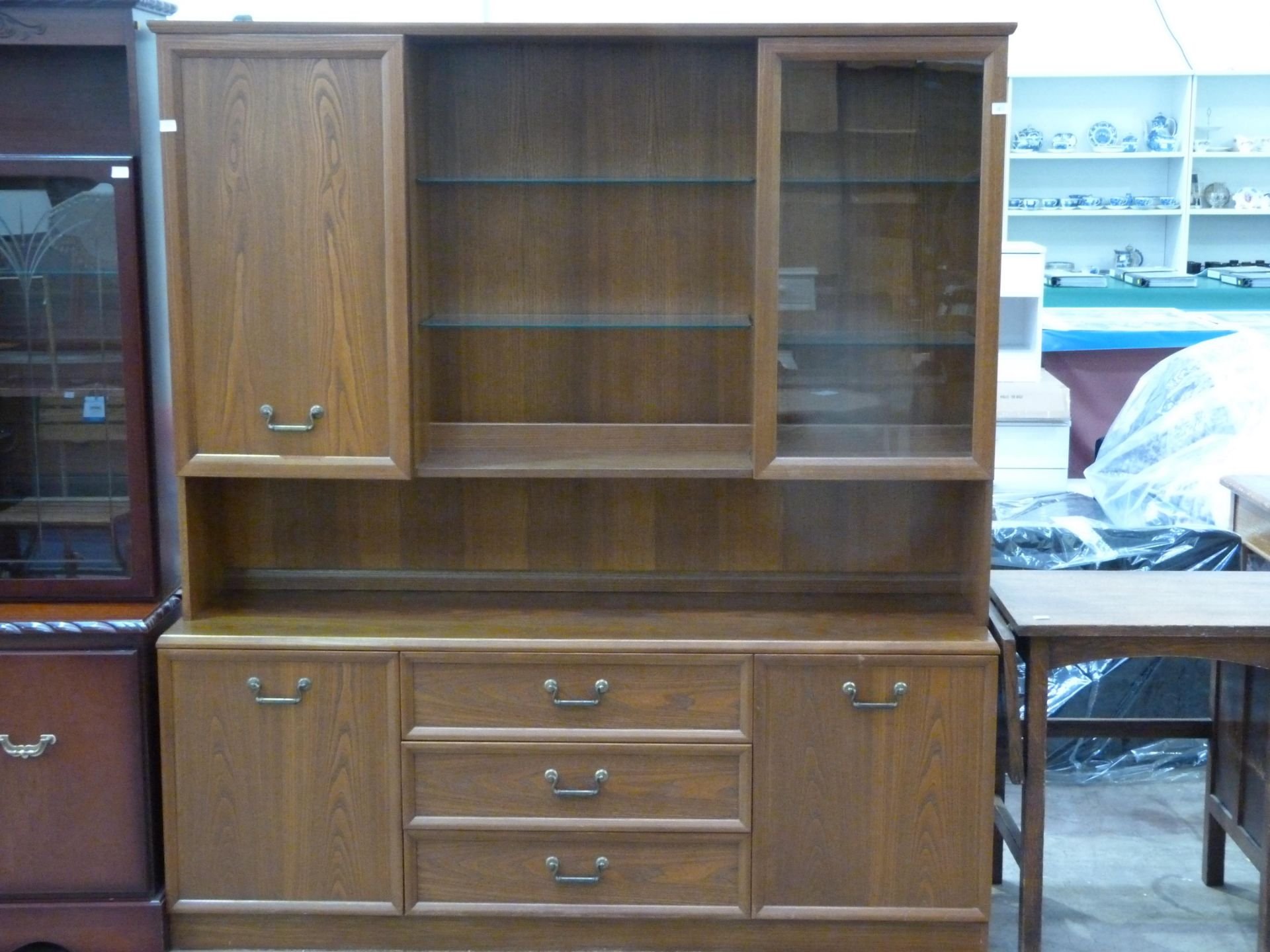 A large G-Plan elm buffet unit featuring four doors, three drawers & nine shelves (H186cm, L165cm,
