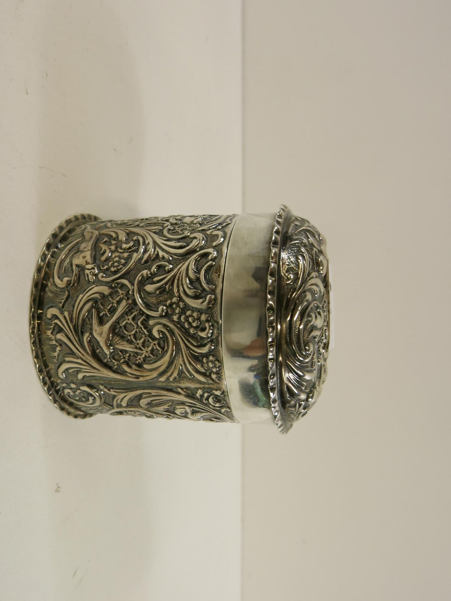 A late Victorian silver dressing table box of cylindrical form with detachable cover, The whole