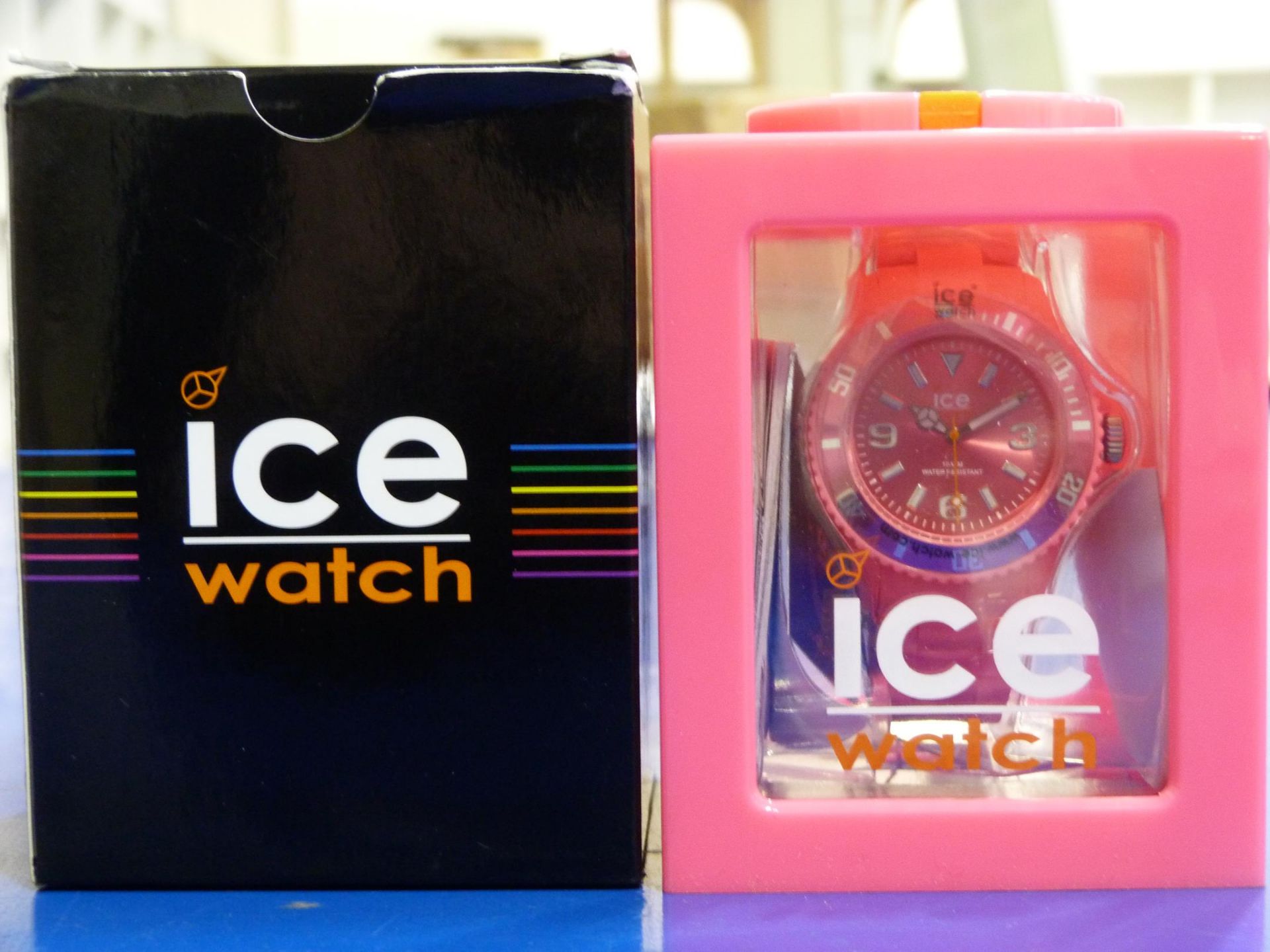 An unused boxed Ice watch in 'solid pink' (est £40-£50)