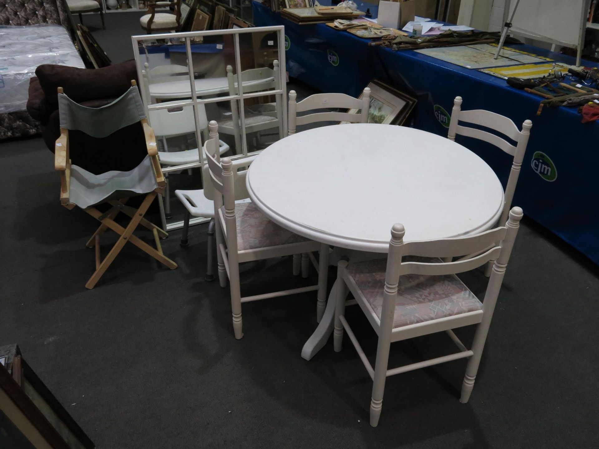 A painted circular table (104cm Diameter) together with four similar chairs with fabric covered