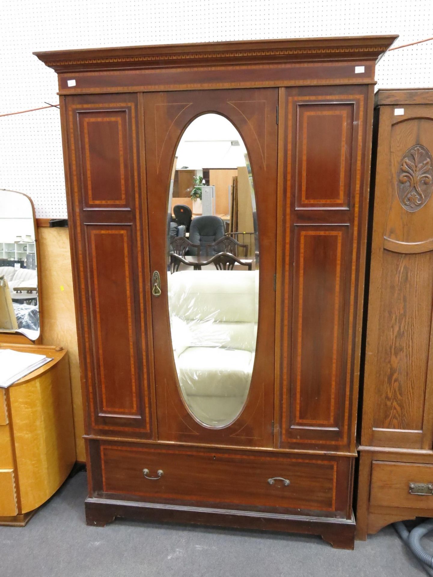 An inlaid Mahogany wardrobe with mirror door and single drawer below. (Height-202cm, Width-116.