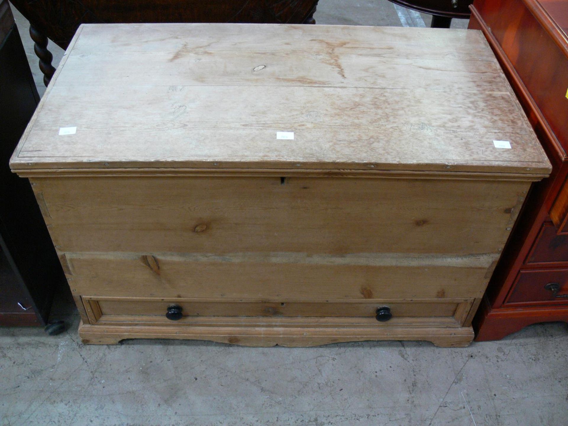 A pine 'blanket' box with drawer below. Two fitted metal drop handles, fitted to the side (H78cm