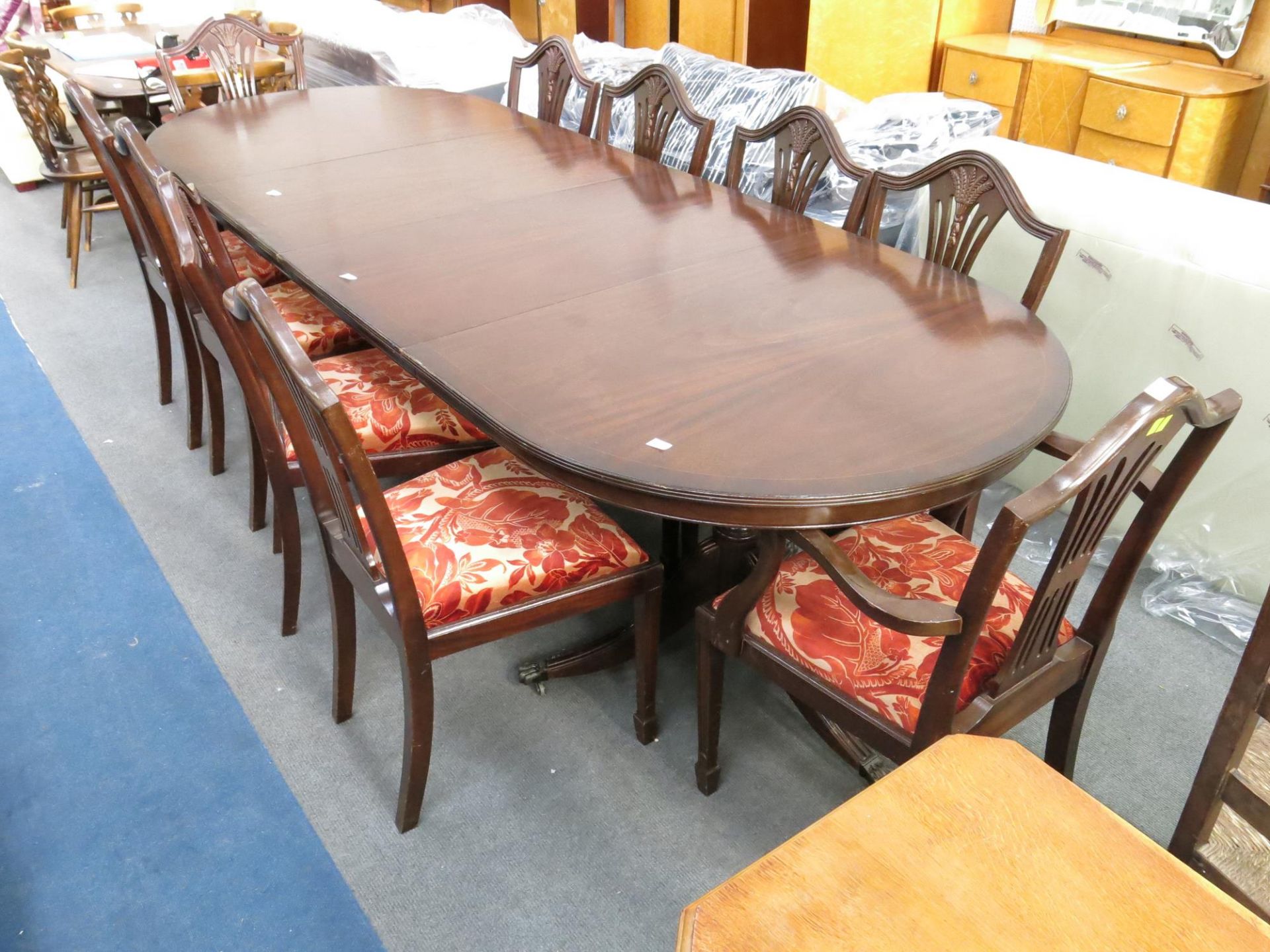 A large dining table (with two extra leaves) (160cm without extra leaves) With eight pedestal chairs