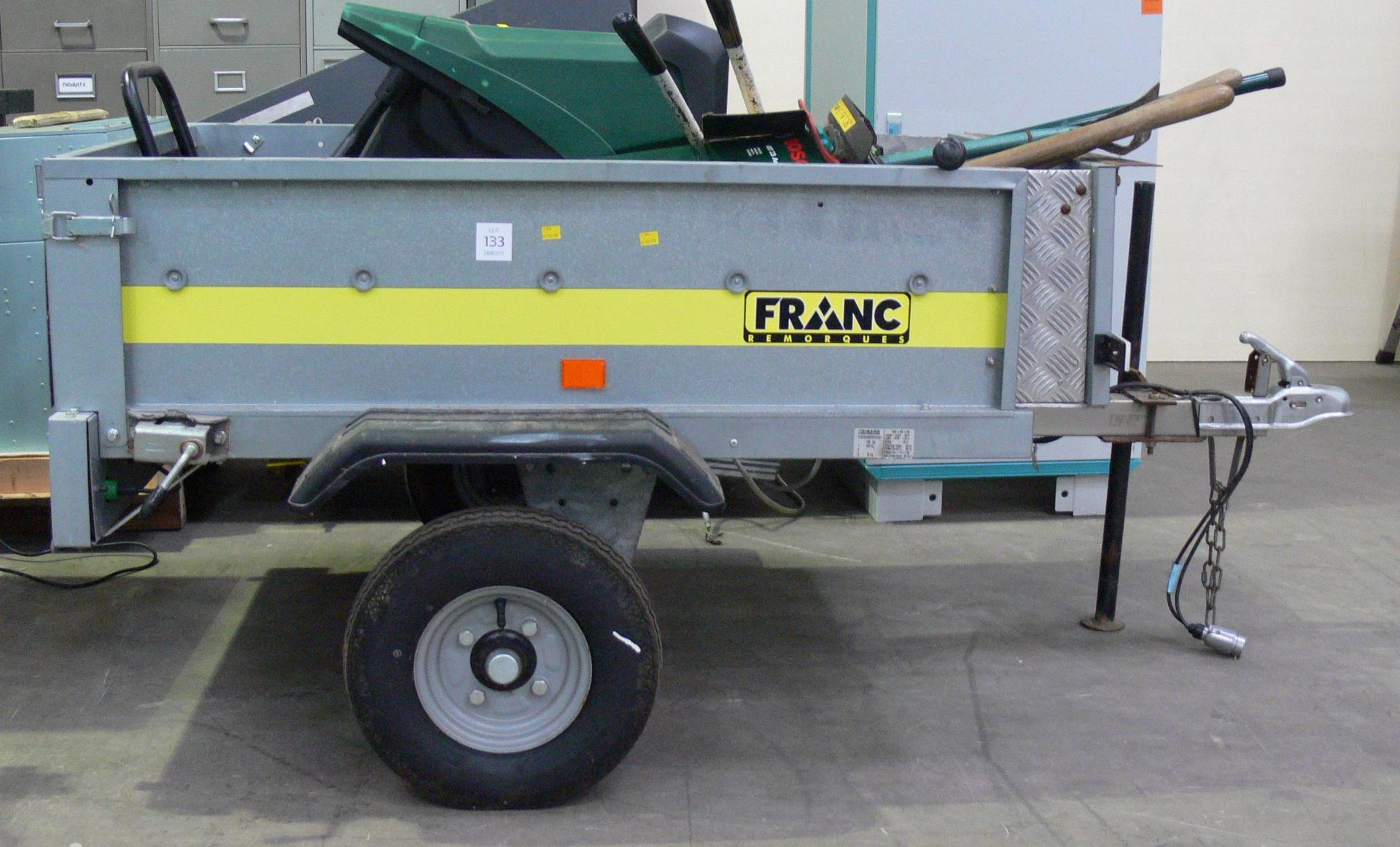 A small Franc Remorques single axle trailer (contents not included). This trailer has had