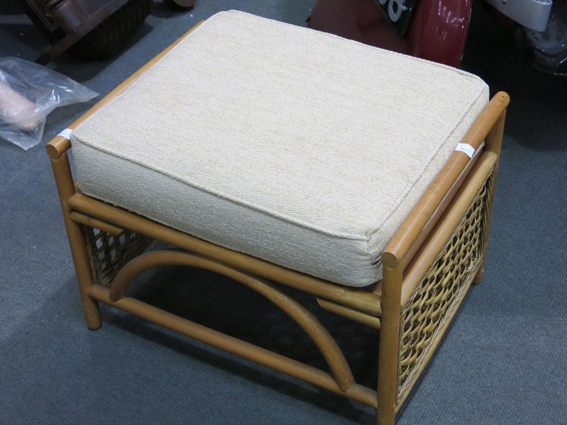 A cane stool with upholstered seat (H 41cm, W 60cm, D 46cm) (est £20 - £30)