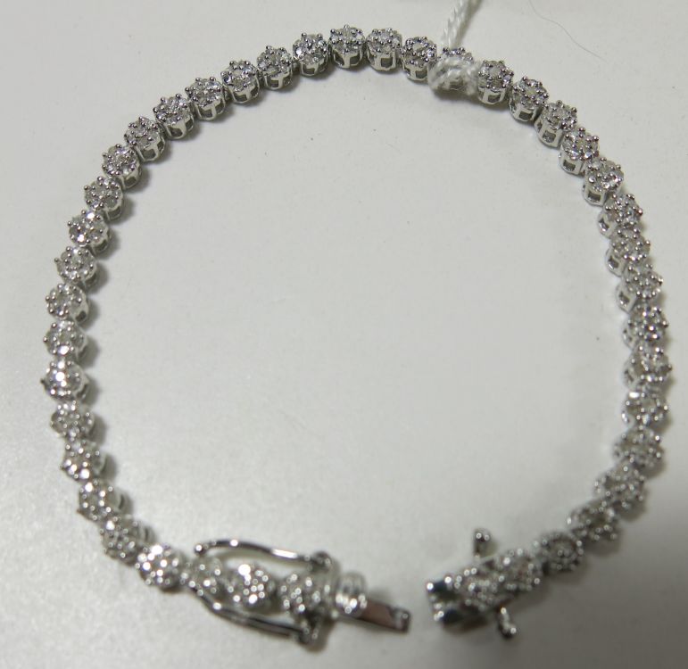 This is a Timed Online Auction on Bidspotter.co.uk, Click here to bid.  Multi Diamond set hallmarked