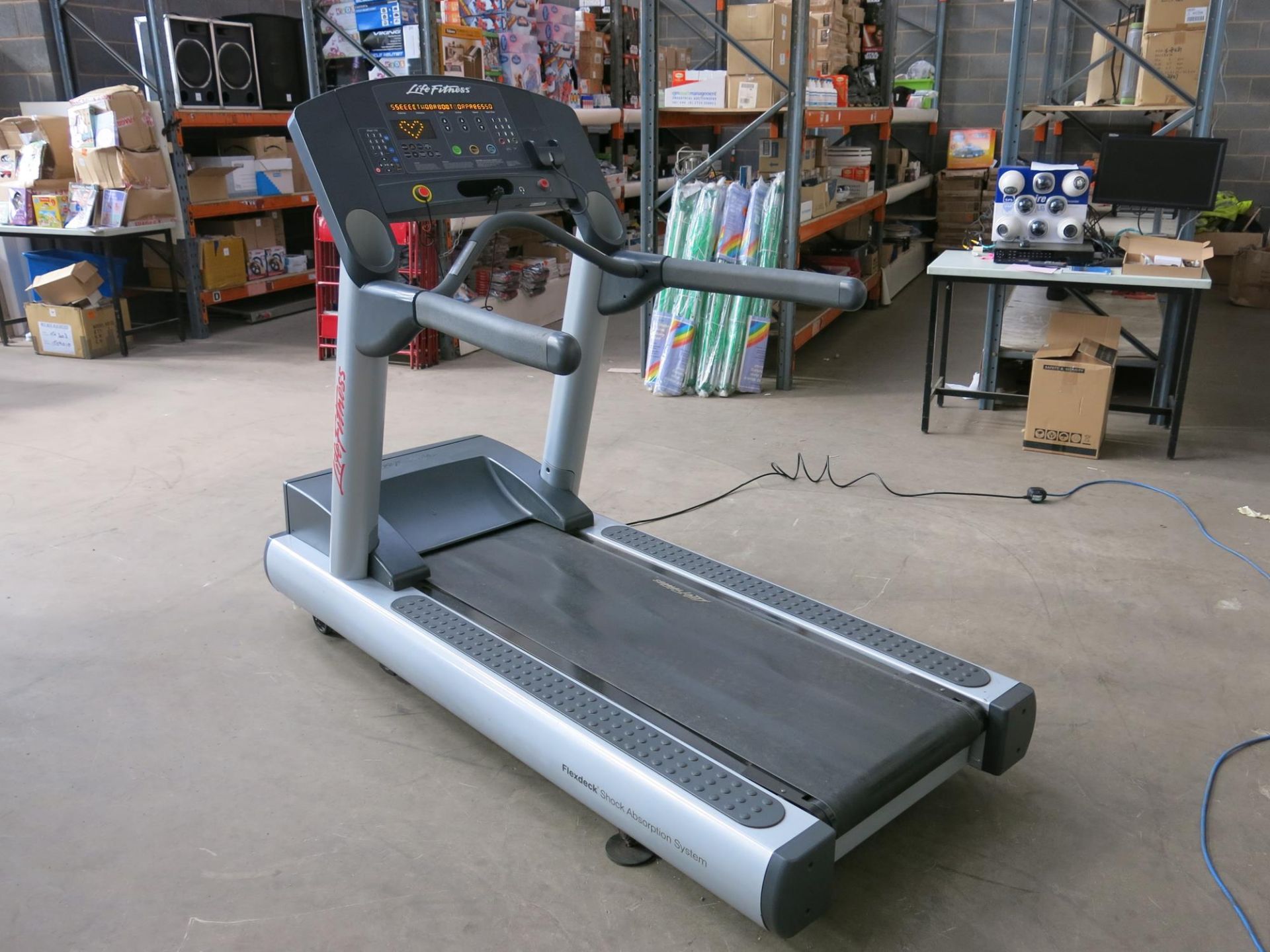 * A Life Fitness CLSTINHXK Treadmill, YOM 2013, complete with iPod docking station, incline/