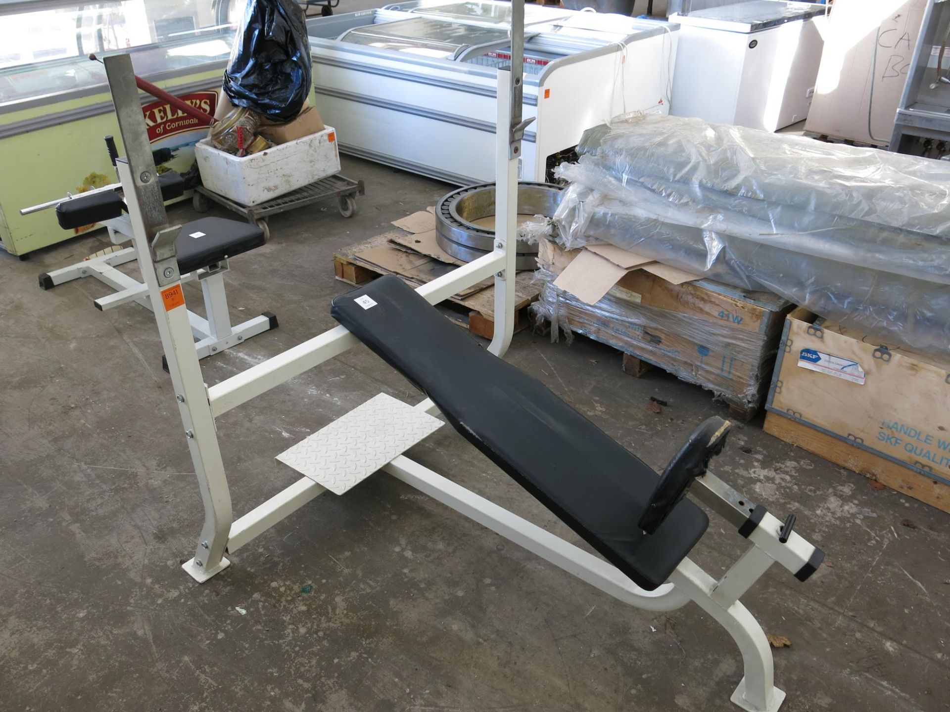 A reclined weight bench with adjustable seat. Please note this lot has a £5 +VAT lift out charge