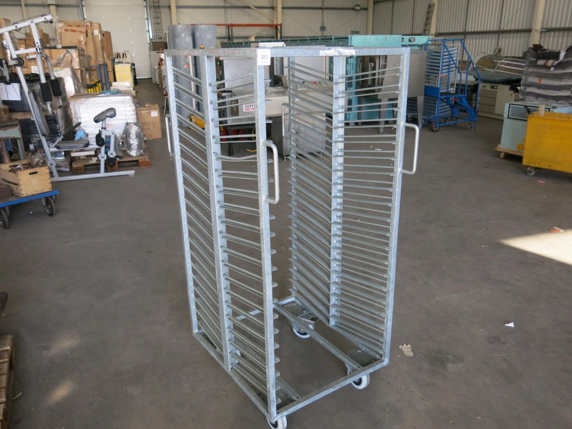 A Galvanised slanted tray trolley. Please note this lot has a £5 +VAT lift out charge.