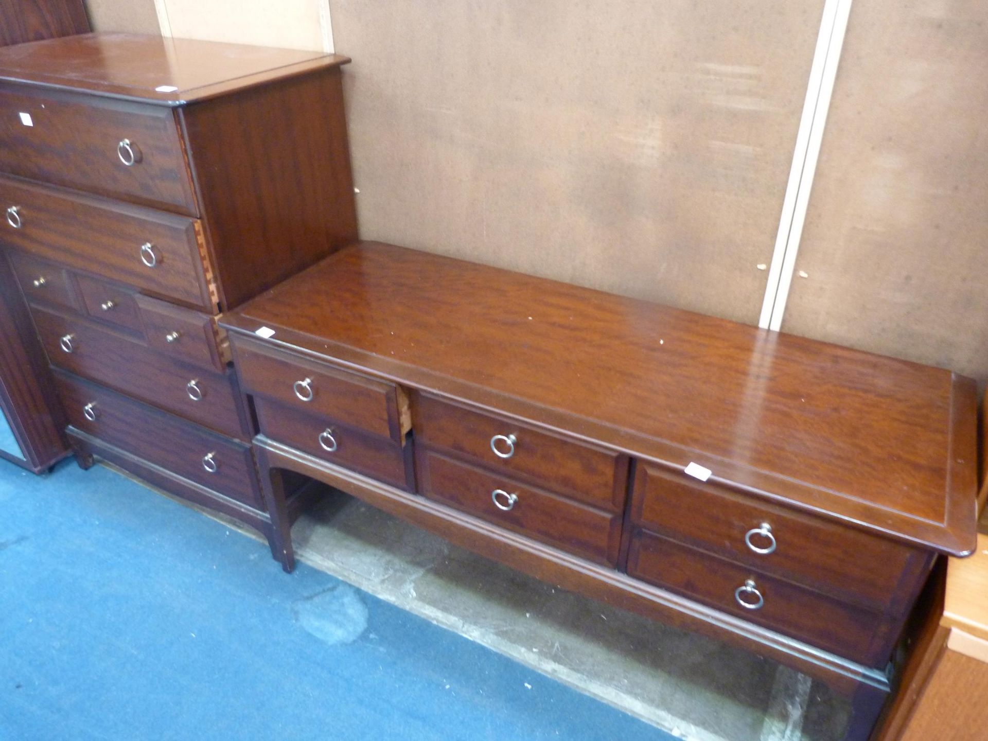 A Stag Tallboy with seven drawers (H 112cm, W 82cm, D 46.5cm) together with a Stag Sideboard (H 71cm