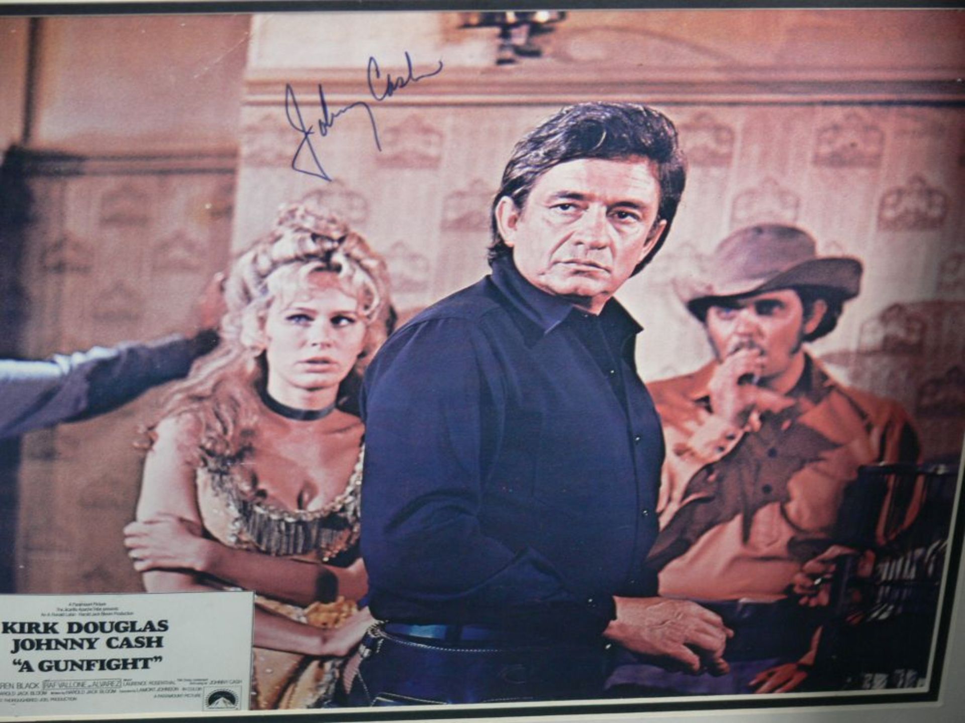 A signed Johnny Cash Poster in a frame (frame 49cm x 79cm) together with five pictures of Adam Faith - Image 5 of 7