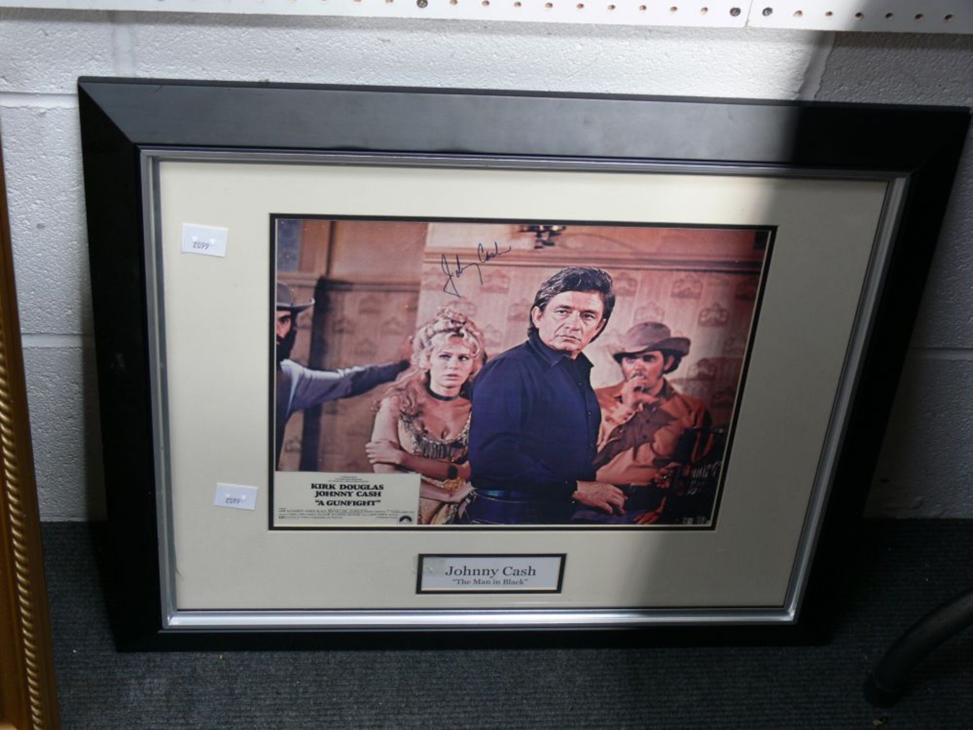 A signed Johnny Cash Poster in a frame (frame 49cm x 79cm) together with five pictures of Adam Faith - Image 4 of 7