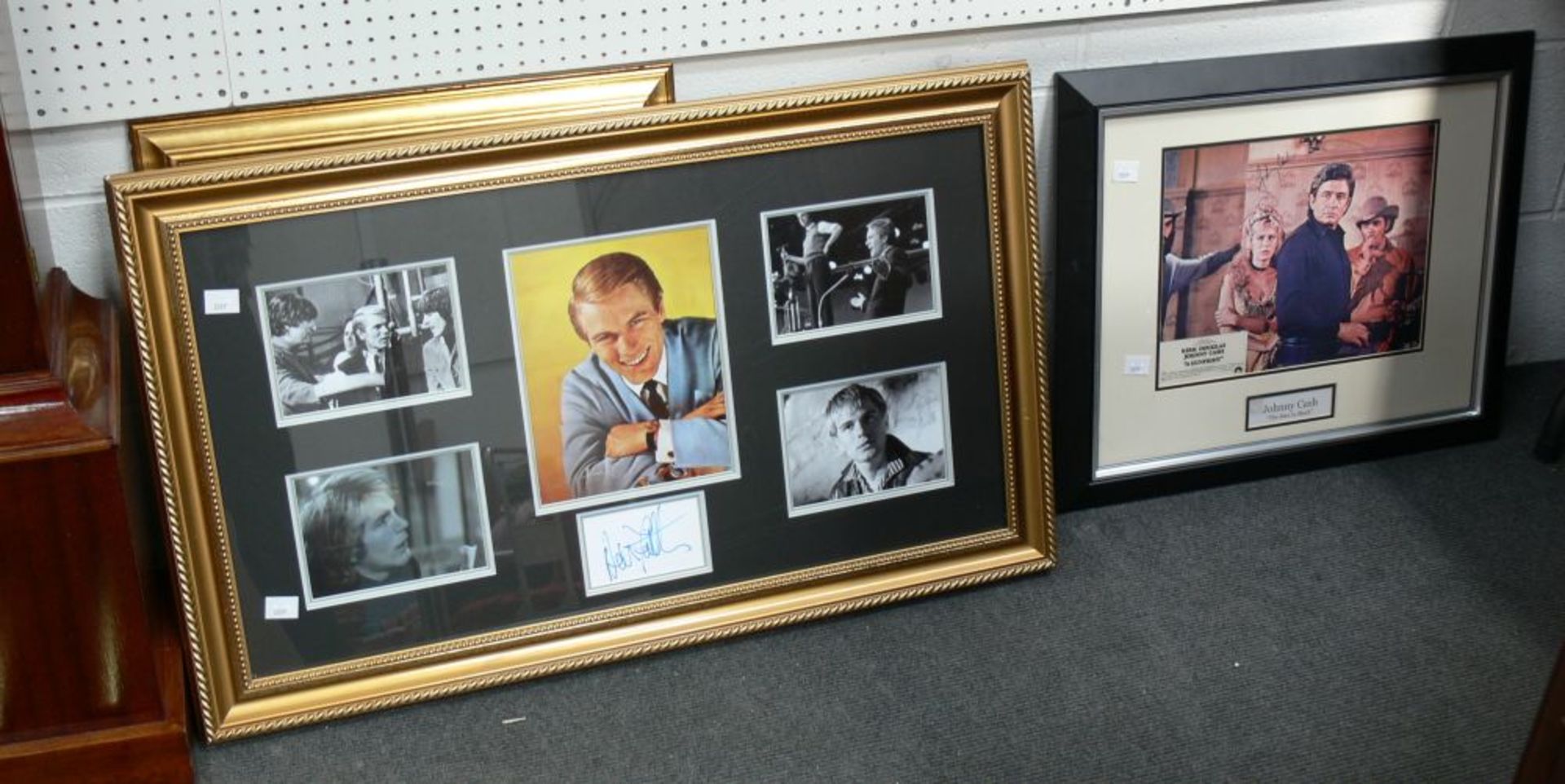 A signed Johnny Cash Poster in a frame (frame 49cm x 79cm) together with five pictures of Adam Faith