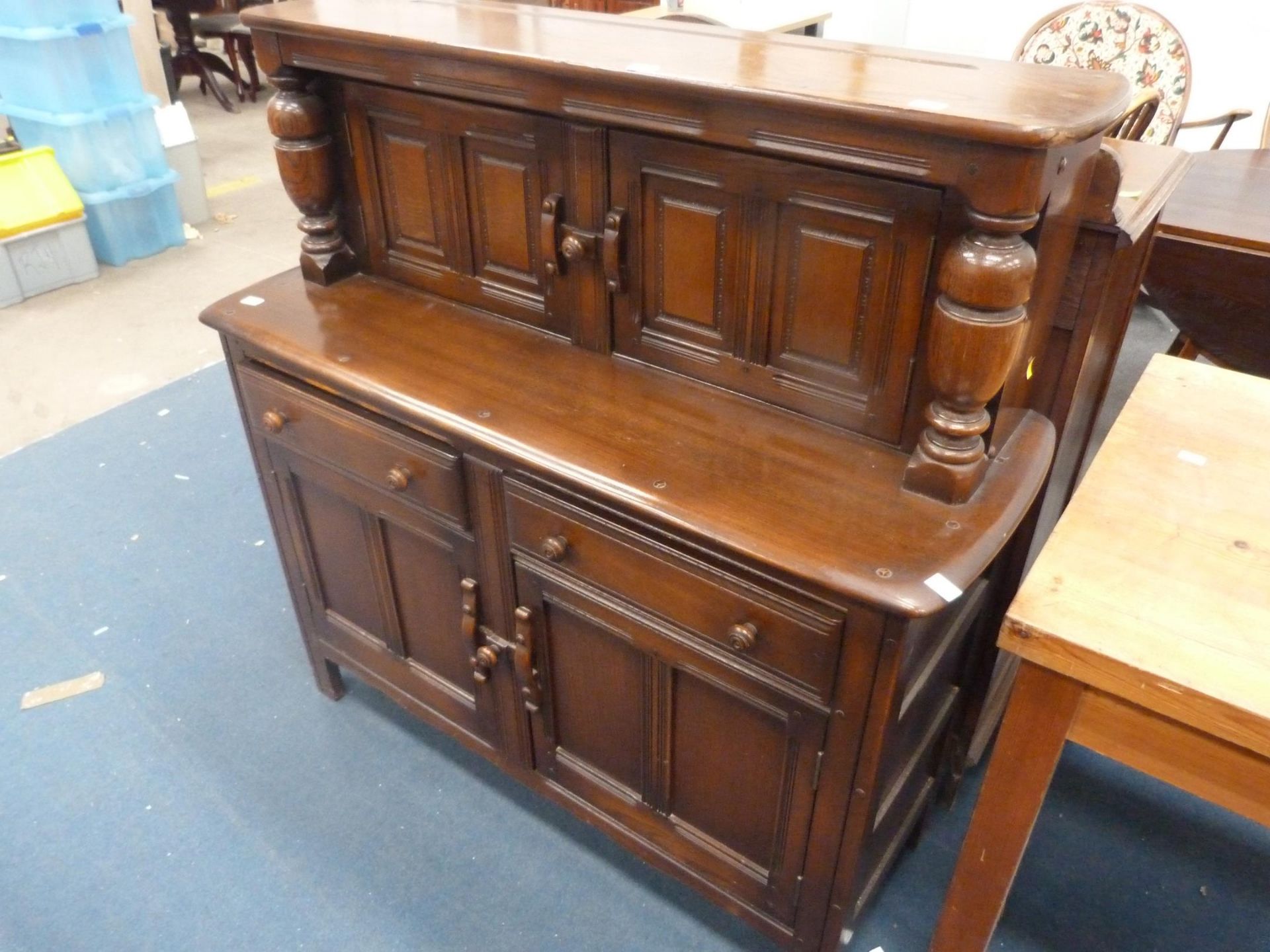 An Ercol Court Cabinet (with cutlery drawer and contents) (H 126cm, W 123cm, D 45cm) (est. £50-£80)