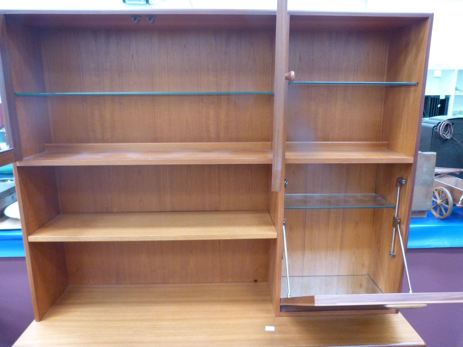 A teak wall unit with part glazed and shelved top, drinks cabinet to the sides and drawers and - Image 2 of 4