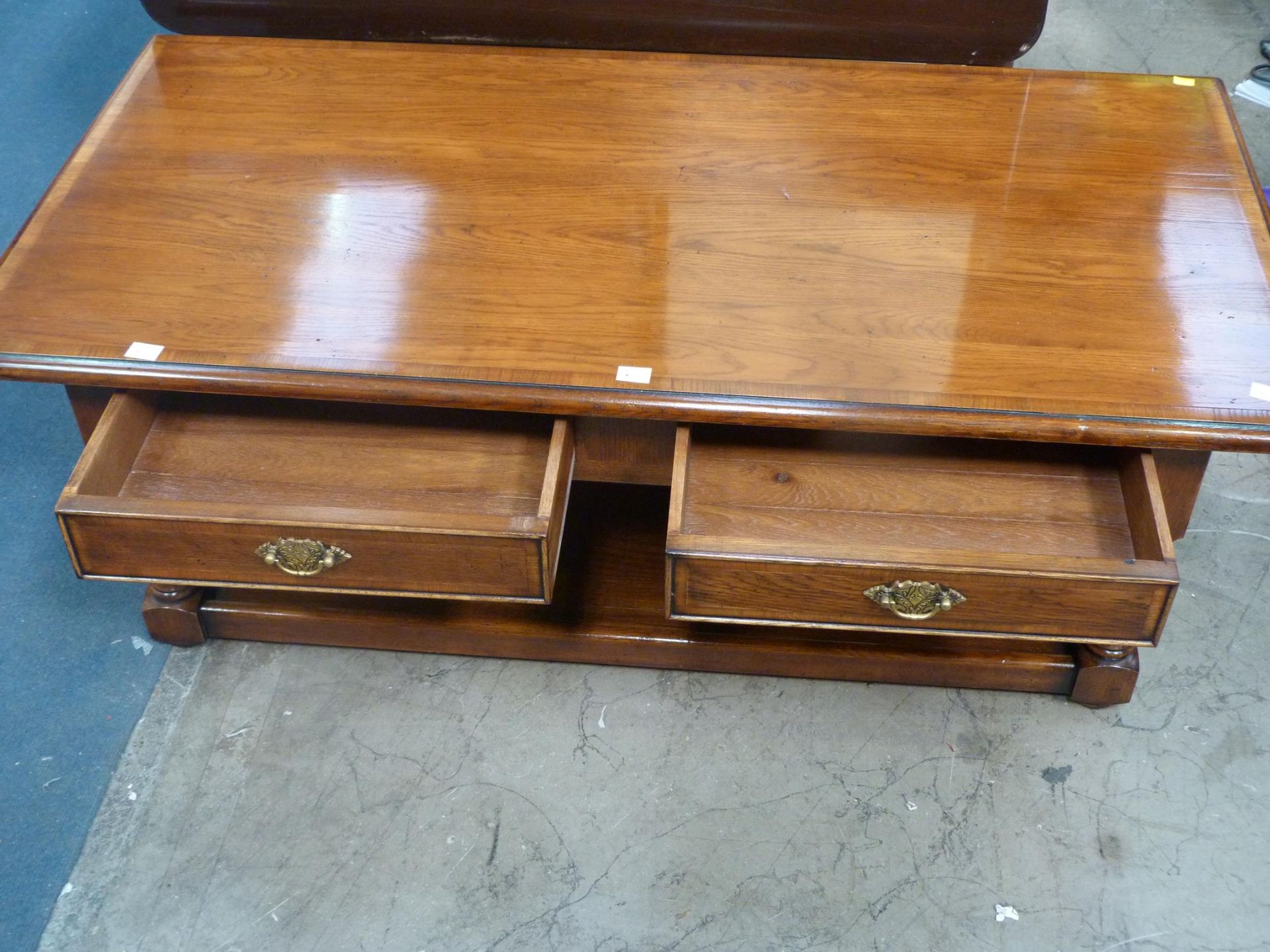 A Walnut Coffee Table with two drawers with metal drop handles, with undertier (H 46cm, W 129cm, D - Image 2 of 2